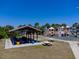 Community playground featuring slides, a picnic area, and nearby tropical foliage for Gathering enjoyment and relaxation at 865 Ladyfish Ave # C104, New Smyrna Beach, FL 32169