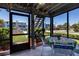 Inviting screened porch with outside view, decorated with coastal shell accents at 865 Ladyfish Ave # C104, New Smyrna Beach, FL 32169