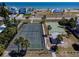 Aerial view showcasing tennis and basketball courts next to the beach, perfect for active lifestyles at 865 Ladyfish Ave # C104, New Smyrna Beach, FL 32169