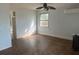 Neutral bedroom with ceiling fan, air conditioner, and hardwood floors at 91 N Triplet Lake Dr, Casselberry, FL 32707