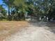 Quaint single-story home nestled among mature trees, offering a serene and private setting at 91 N Triplet Lake Dr, Casselberry, FL 32707