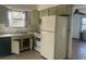 Functional kitchen featuring appliances and ample cabinet space, ready for updates at 91 N Triplet Lake Dr, Casselberry, FL 32707
