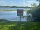 Beautiful lake view featuring a bird sanctuary sign on the shoreline at 91 N Triplet Lake Dr, Casselberry, FL 32707