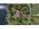 Charming lakefront home with a private dock and lush green surroundings, offering a peaceful retreat with recreational opportunities at 9222 Charles E Limpus Rd, Orlando, FL 32836
