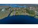 Scenic lakefront property features mature trees and expansive waterfront views offering serene privacy and natural beauty at 9222 Charles E Limpus Rd, Orlando, FL 32836