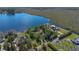 Aerial view of luxurious homes with lake frontage, lush greenery, and private docks at 9222 Charles E Limpus Rd, Orlando, FL 32836