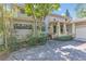 Charming two-story home with stone accents and a well-maintained front yard at 9222 Charles E Limpus Rd, Orlando, FL 32836