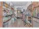 Organized garage featuring shelving, tools, a bicycle, and ample space for storage and projects at 9222 Charles E Limpus Rd, Orlando, FL 32836