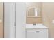 A bathroom featuring a white vanity and mirror at 10665 Whitman Cir, Orlando, FL 32821