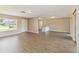 Open-concept living space with stylish wood floors, and a bright and welcoming atmosphere at 10665 Whitman Cir, Orlando, FL 32821