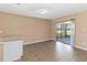 Bright living space with modern floors and sliding doors offering seamless indoor-outdoor living at 10665 Whitman Cir, Orlando, FL 32821