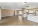 Open floor plan with wood floors seamlessly connects the kitchen and living areas at 10665 Whitman Cir, Orlando, FL 32821