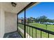 Relax on this balcony with lovely views of lush green spaces, lake, and blue skies at 1152 Grove St, Maitland, FL 32751