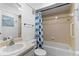 Cozy bathroom featuring a shower-tub combo and neutral-toned walls with complementary fixtures and decor at 1152 Grove St, Maitland, FL 32751