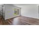 Bright bedroom with wood-look floors, a view through the window, and neutral paint at 1152 Grove St, Maitland, FL 32751
