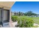 Open front door shows view of expansive lawn with lake view in the distance on a bright day at 1152 Grove St, Maitland, FL 32751