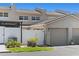 Inviting exterior elevation showcasing a townhome with an attached garage, well-maintained landscaping, and manicured lawn at 1152 Grove St, Maitland, FL 32751