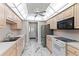 Bright kitchen features white countertops and appliances with an oven range and built-in microwave at 1152 Grove St, Maitland, FL 32751