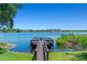 Expansive lake view from the end of a wooden private dock on a bright day at 1152 Grove St, Maitland, FL 32751