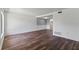 Open-concept living room with wood-look floors, showcasing stylish details and bright, neutral tones at 1152 Grove St, Maitland, FL 32751