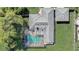 Aerial view of house showing roof, screened pool, and spacious backyard at 1155 Collins Ave, Orange City, FL 32763