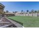 Expansive backyard featuring lush lawn and a separate brick building with a fenced perimeter at 1155 Collins Ave, Orange City, FL 32763