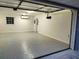 Clean, epoxy-floored garage with natural light and climate control at 1155 Collins Ave, Orange City, FL 32763