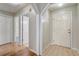 Hallway shot highlighting tile and wood flooring at 1155 Collins Ave, Orange City, FL 32763