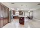 Open concept kitchen with large island, stainless steel appliances, and modern finishes at 1155 Collins Ave, Orange City, FL 32763