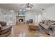 Cozy living room with hardwood floors and brick fireplace at 1155 Collins Ave, Orange City, FL 32763