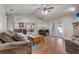 Open-concept living room with hardwood floors at 1155 Collins Ave, Orange City, FL 32763