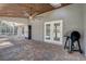 Spacious outdoor patio with brick flooring, a ceiling fan and a grill, perfect for entertaining or enjoying the outdoors at 1155 Collins Ave, Orange City, FL 32763