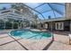 Relax by the pool in your screened-in pool and spa, the perfect setting to enjoy the Florida lifestyle at 1155 Collins Ave, Orange City, FL 32763