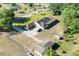 An aerial view displays the home’s layout, driveway, and ample green space surrounding the property at 117 Orange Ridge Dr, Longwood, FL 32779