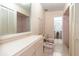 Spacious bathroom featuring toilet, bidet, large mirror, and adjacent shower stall at 117 Orange Ridge Dr, Longwood, FL 32779