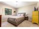 Comfortable bedroom with a full bed, side table, large window with natural light, and a ceiling fan at 117 Orange Ridge Dr, Longwood, FL 32779