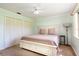 Charming bedroom with a comfortable bed, large closets, and a ceiling fan for added comfort at 117 Orange Ridge Dr, Longwood, FL 32779