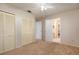 Spacious bedroom with closet space and open doorway to an adjacent bathroom with neutral-toned walls at 117 Orange Ridge Dr, Longwood, FL 32779