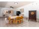 Bright dining area with neutral tile, light-colored wooden table and chairs, plus backyard views at 117 Orange Ridge Dr, Longwood, FL 32779