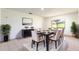 Elegant dining room with stylish table setting, black buffet, and bright window at 117 Orange Ridge Dr, Longwood, FL 32779