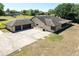 A charming home featuring an attached two-car garage and a spacious driveway for ample parking and curb appeal at 117 Orange Ridge Dr, Longwood, FL 32779
