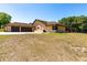 The back of the home has a large yard, screened-in porch and a large two-car garage at 117 Orange Ridge Dr, Longwood, FL 32779