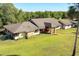 Expansive single-story home with brick accents, well-manicured lawn, and mature trees at 117 Orange Ridge Dr, Longwood, FL 32779