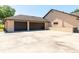 Exterior shot of the home's expansive driveway and attached two-car garage with brown doors at 117 Orange Ridge Dr, Longwood, FL 32779