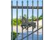 Decorative metal gate featuring horse sculpture, providing an elegant entrance to the property at 117 Orange Ridge Dr, Longwood, FL 32779