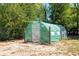 View of outdoor backyard greenhouse structure for gardening and growing plants at 117 Orange Ridge Dr, Longwood, FL 32779
