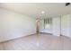Living room with tile floors and built-in cabinets, providing ample storage at 117 Orange Ridge Dr, Longwood, FL 32779