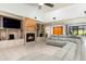 Large living room with tile floors, built in fireplace and TV, and comfortable seating at 117 Orange Ridge Dr, Longwood, FL 32779