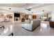 Bright living room with fireplace, built-in shelves, and views of the outdoor seating area at 117 Orange Ridge Dr, Longwood, FL 32779