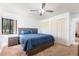 Bedroom showcasing a comfortable bed, a ceiling fan, and closet space, providing a relaxing retreat at 117 Orange Ridge Dr, Longwood, FL 32779